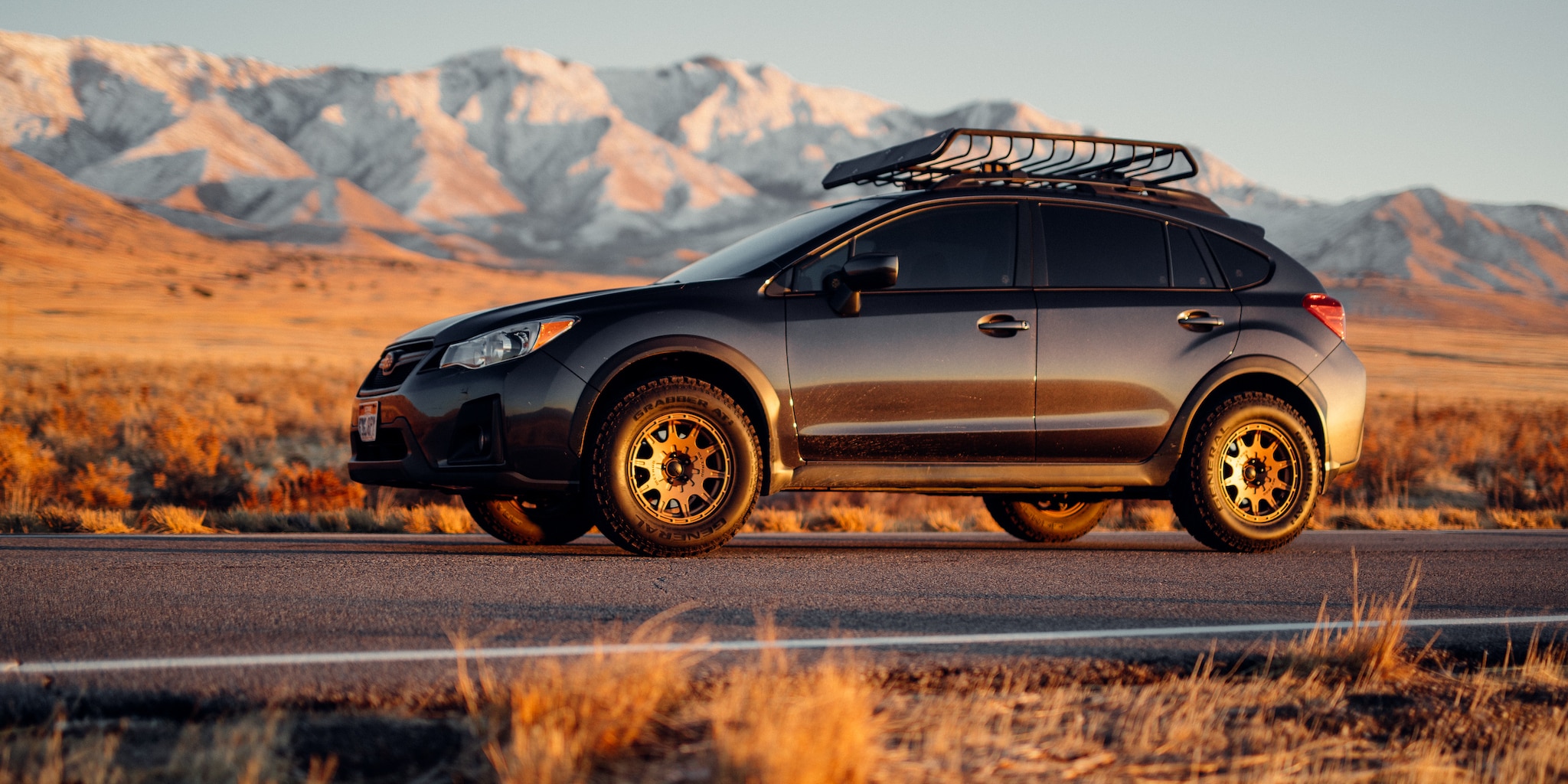 Hatchback car-sharing rental for Avail with mountains in background
