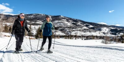 two women cross country ski at Raven Golf Club in Silverthorne, CO