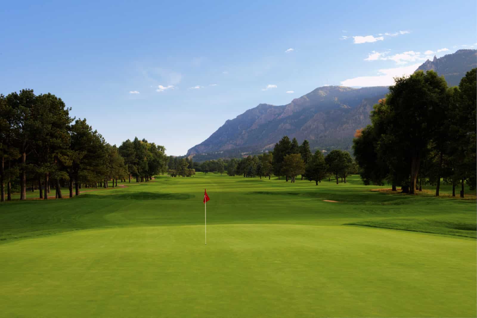 looking back on a par 5 from the putting green at The Broadmoor Golf Course East